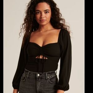 Abercrombie long sleeve black top. Adjustable cutout detail in front.